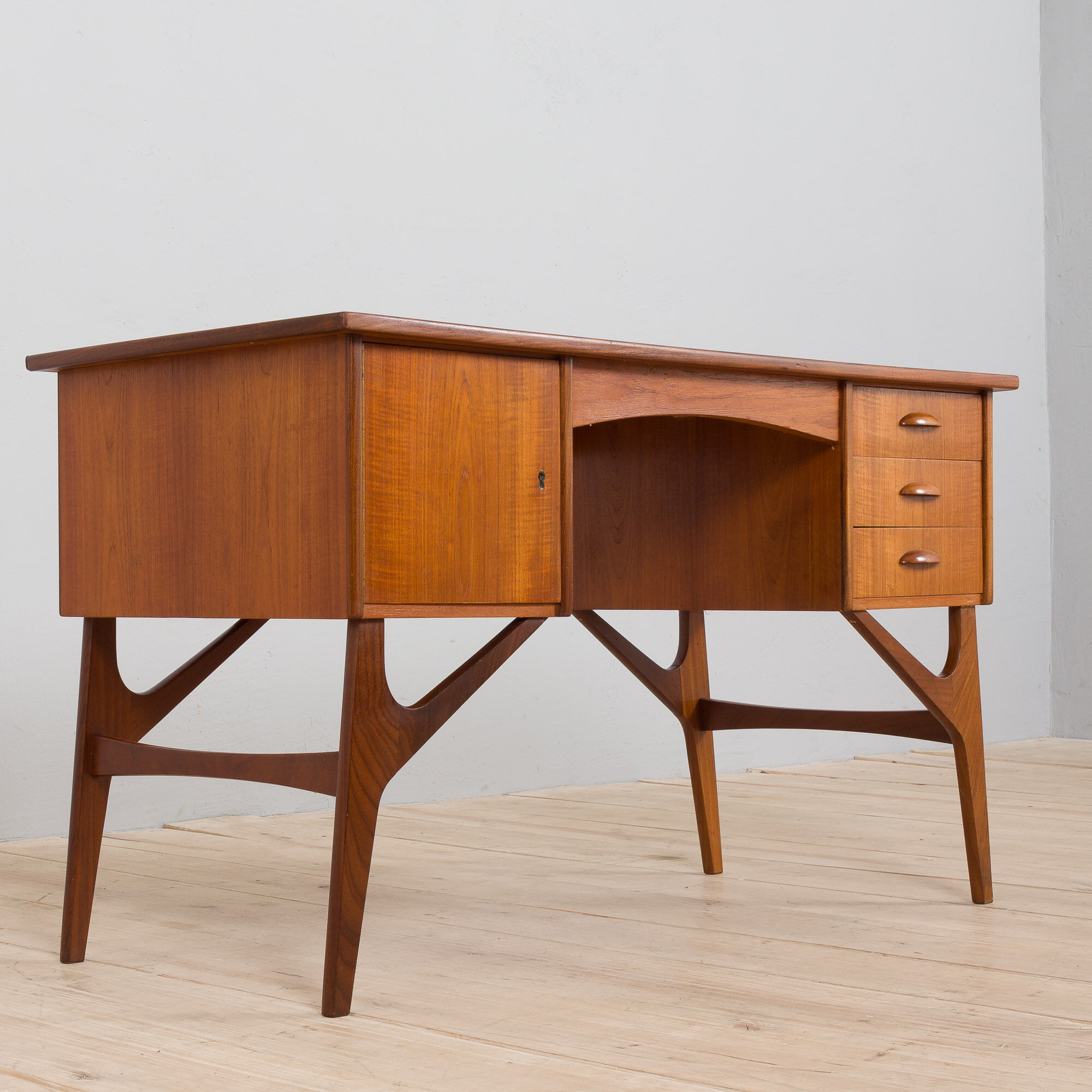 Danish mid century teak desk on sculptural base, 1960s.