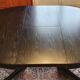 Baumann-type table with 4/8-person extensions.