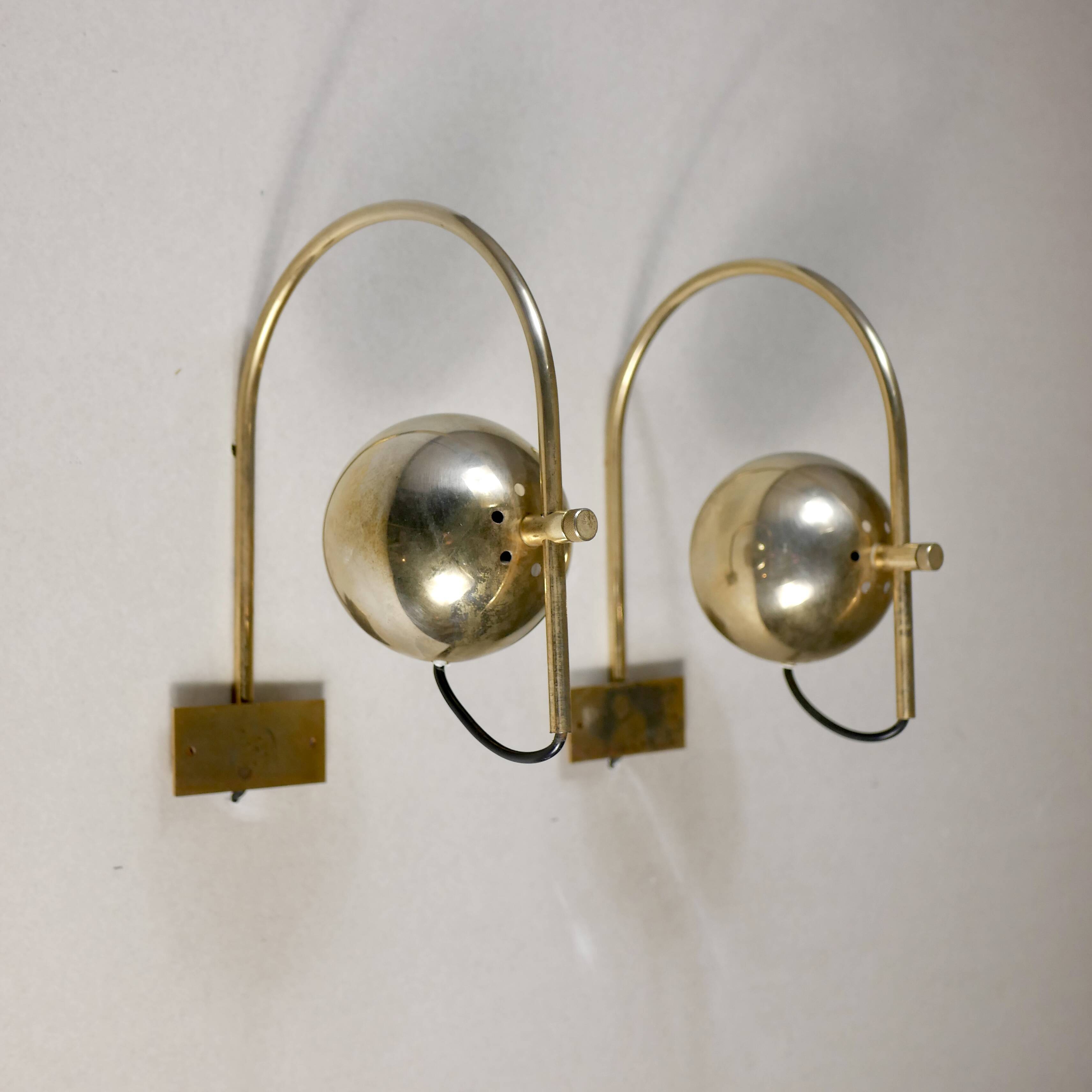 Pair of brass eyeball wall lights