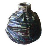 Small Dalpayrat vase shaped ball in polychrome glacured ceramic with relief decoration of a flower signed under the base