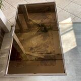 Coffee table with chrome base and mirrored glass top, vintage solar flare decor