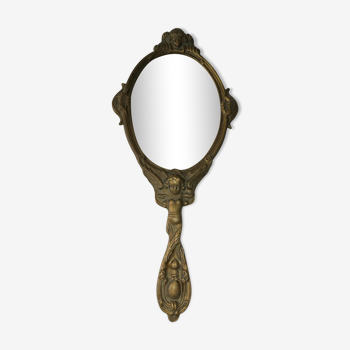 Old hand-facing mirror in gilded bronze