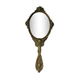 Old hand-facing mirror in gilded bronze