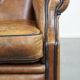 Sheep leather wingback chair finished with black piping