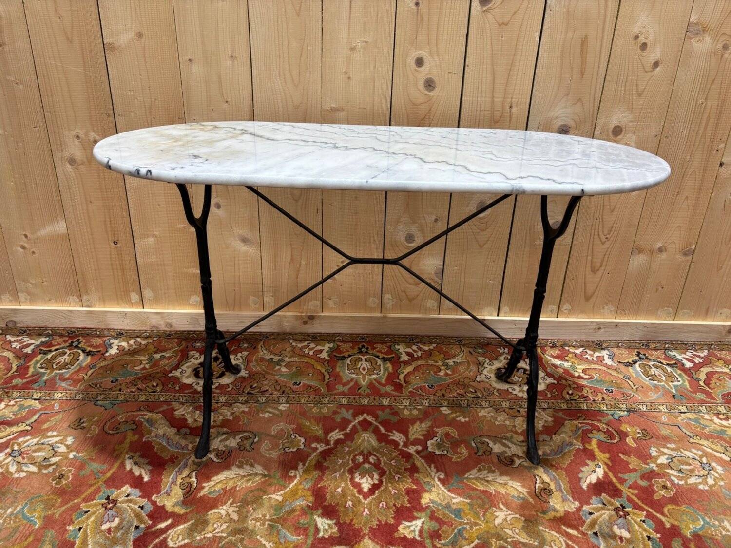 Authentic bistro table with white marble and cast iron from the early 20th century.