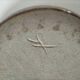 Signed stoneware bowl from Puisaye, relief decoration.