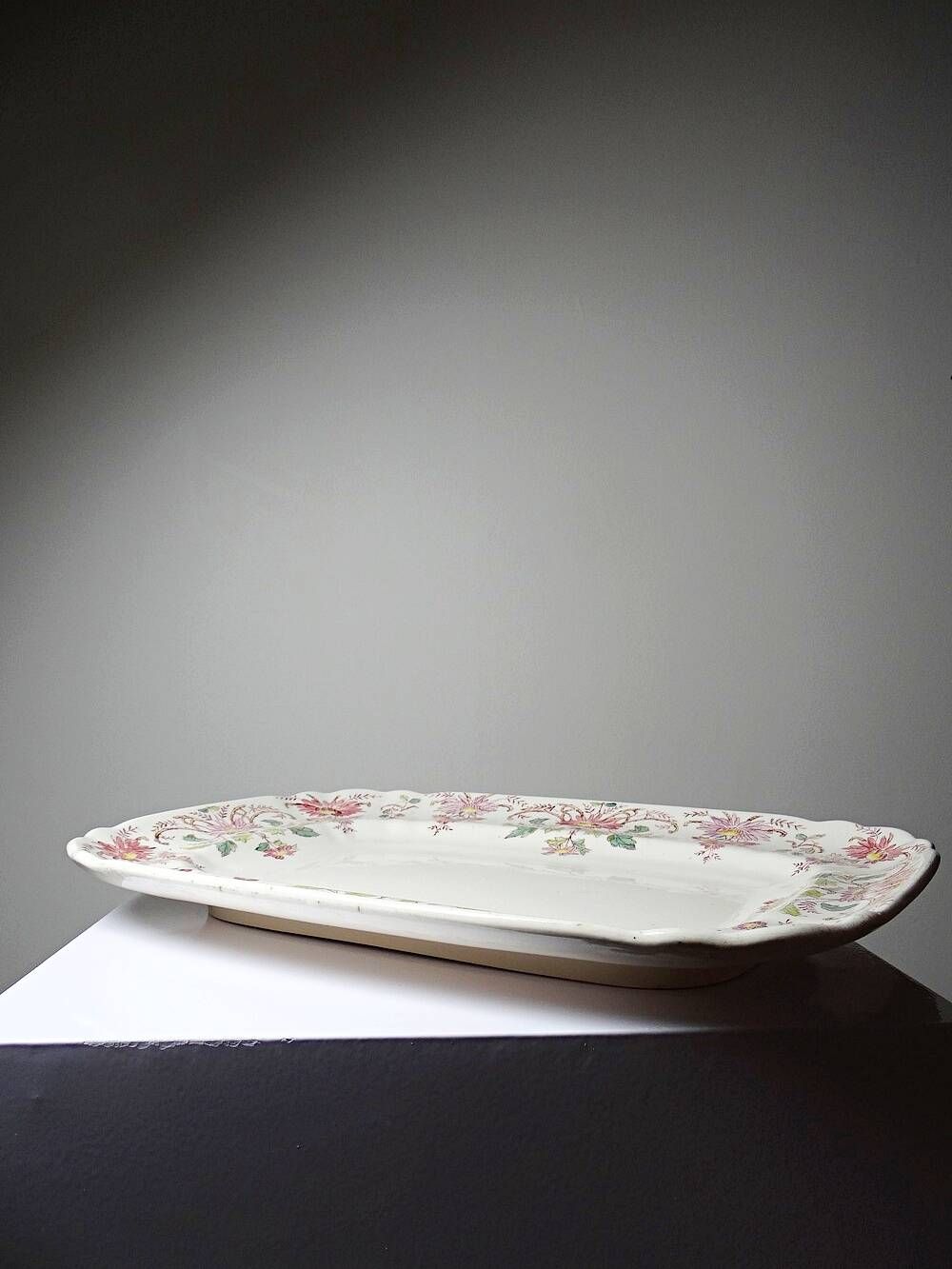 Antique Longchamp serving platter with polychrome daisies in ironstone.