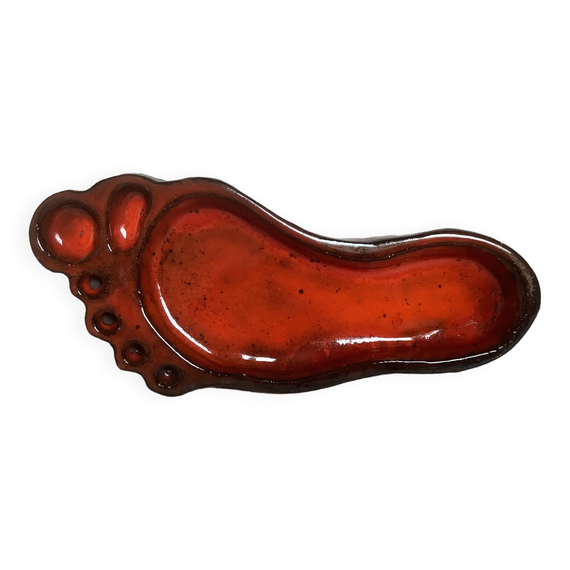 Red ceramic footprint catchall.
