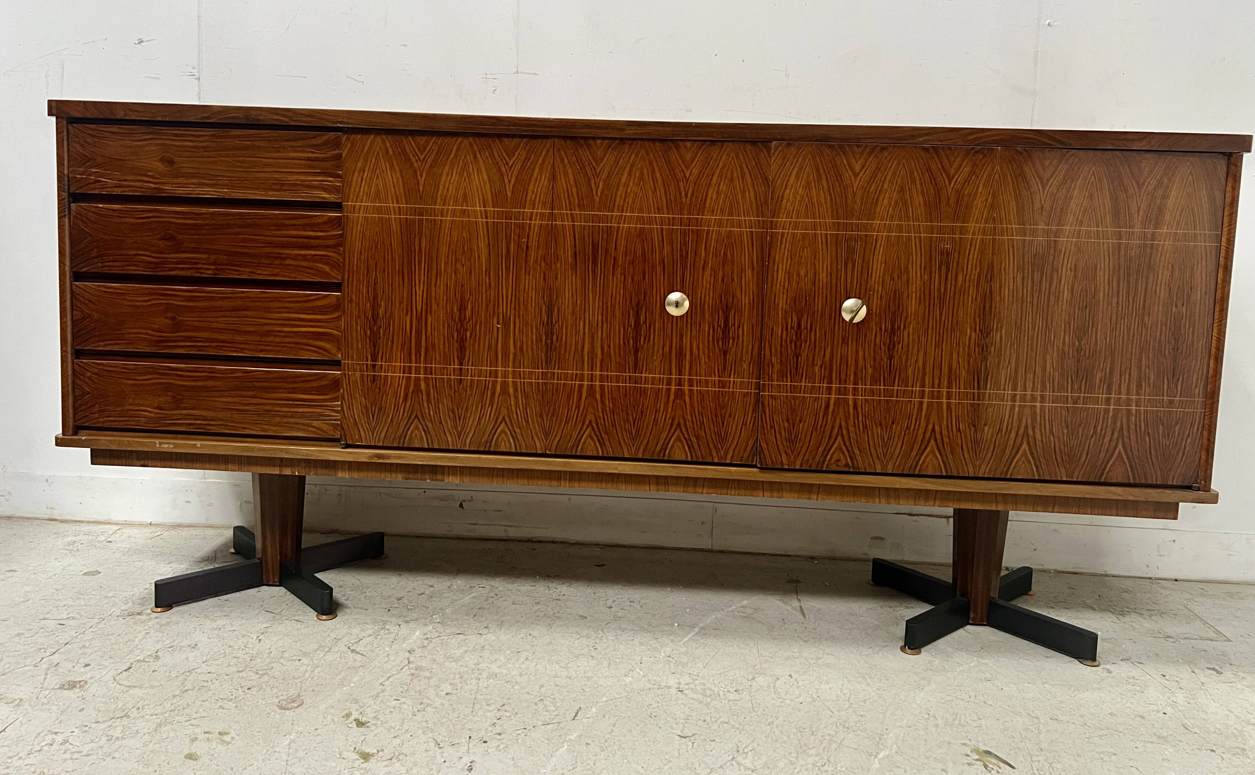 Scandinavian enfilade in veneered wood with iron legs, 20th century.