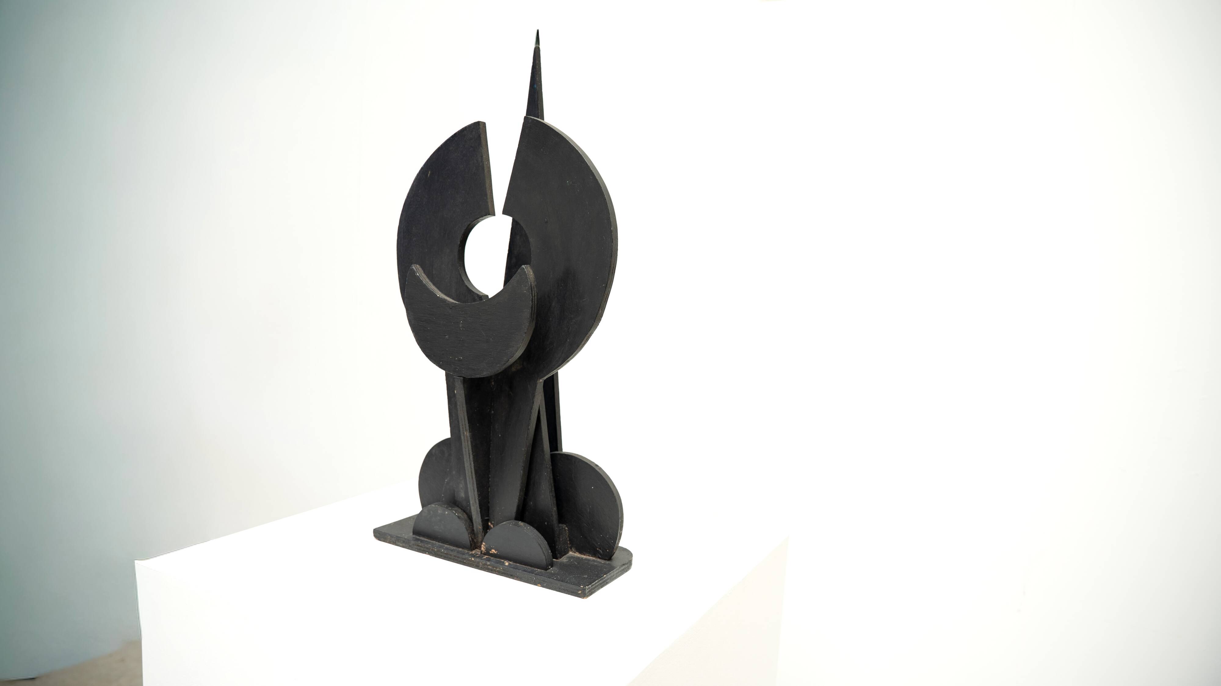 Black brutalist wooden sculpture