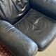 Pair of black leather club armchairs, twentieth century