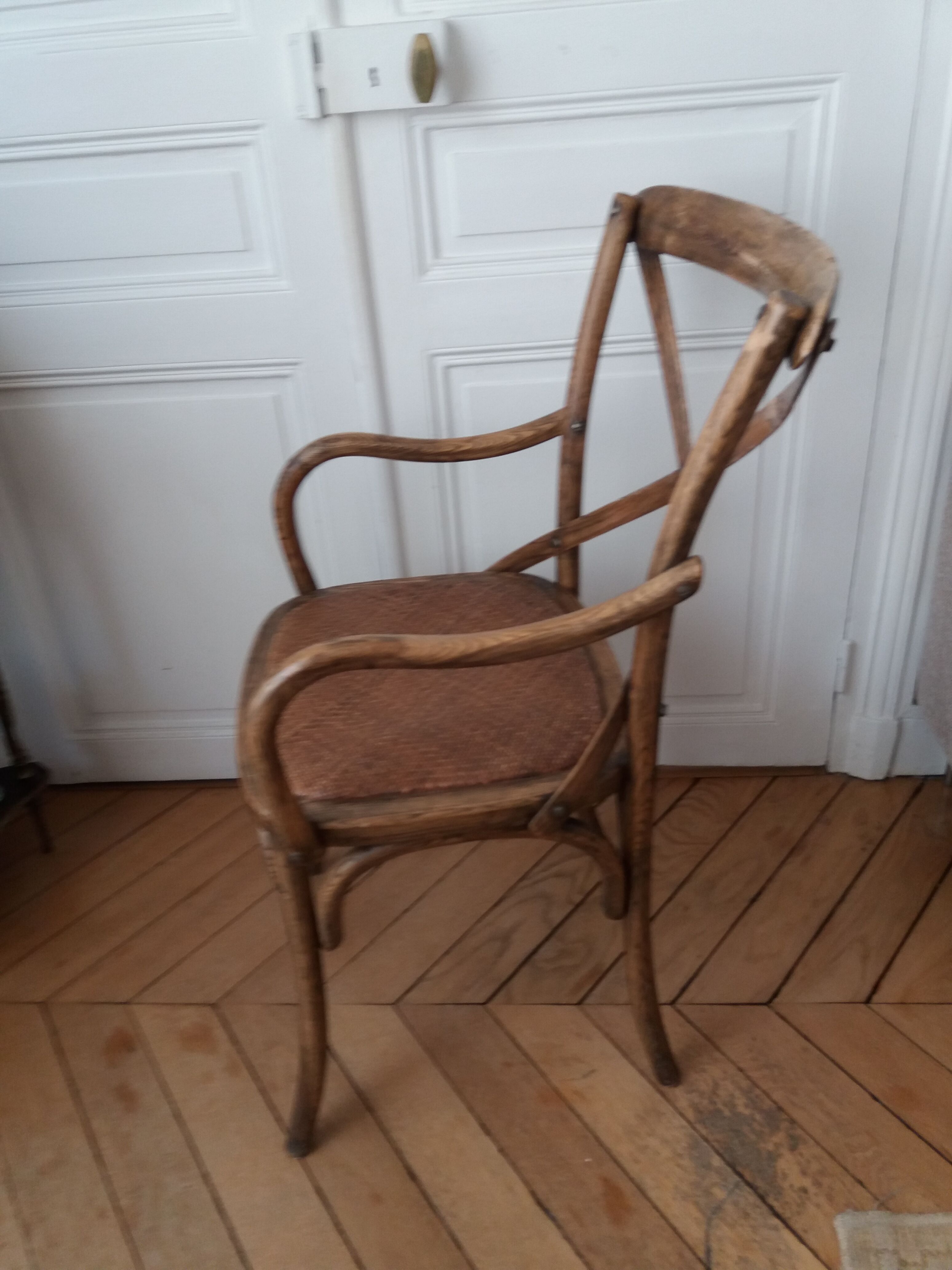 Curved wooden armchair