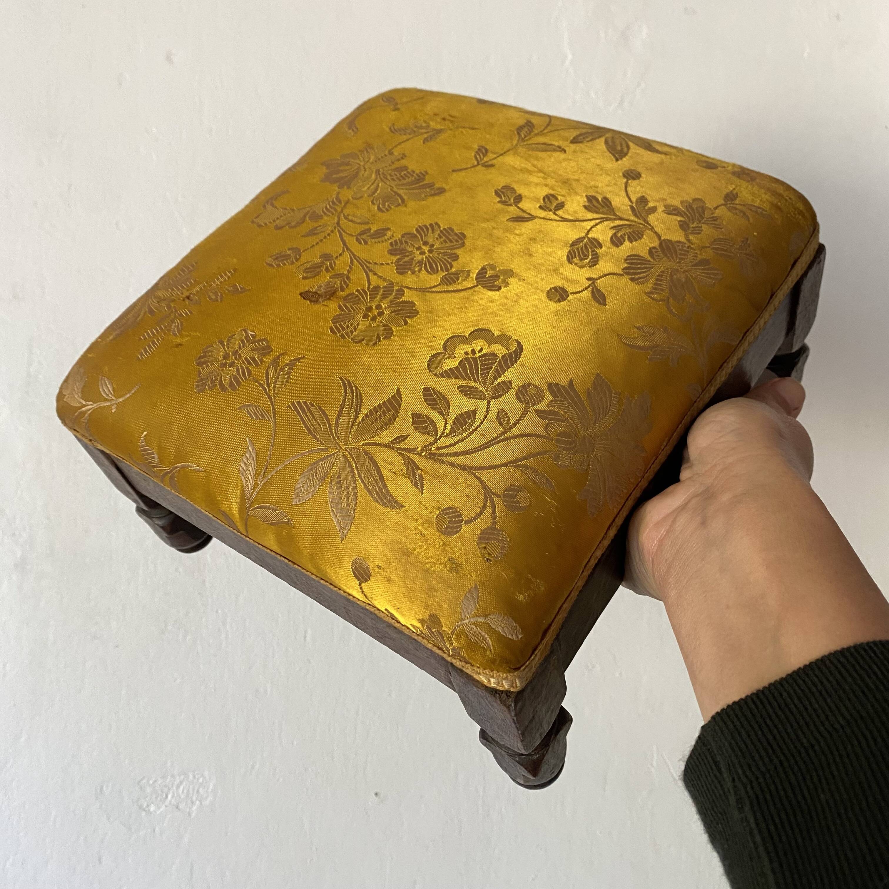 Low stool with antique wood and fabric footrest