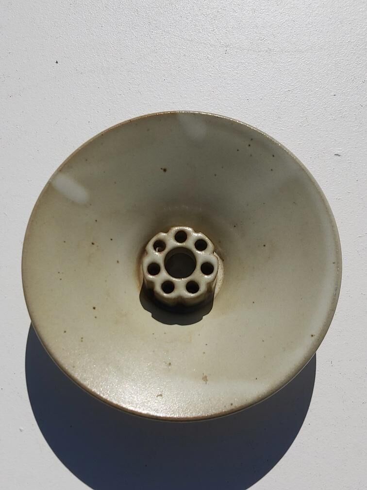 Taizé flower picket cut in sandstone