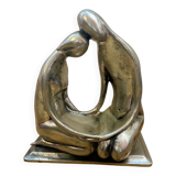 Tin figurine of a couple in love