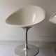 Ero swivel armchair in metal and white shell, p. starck design for kartell