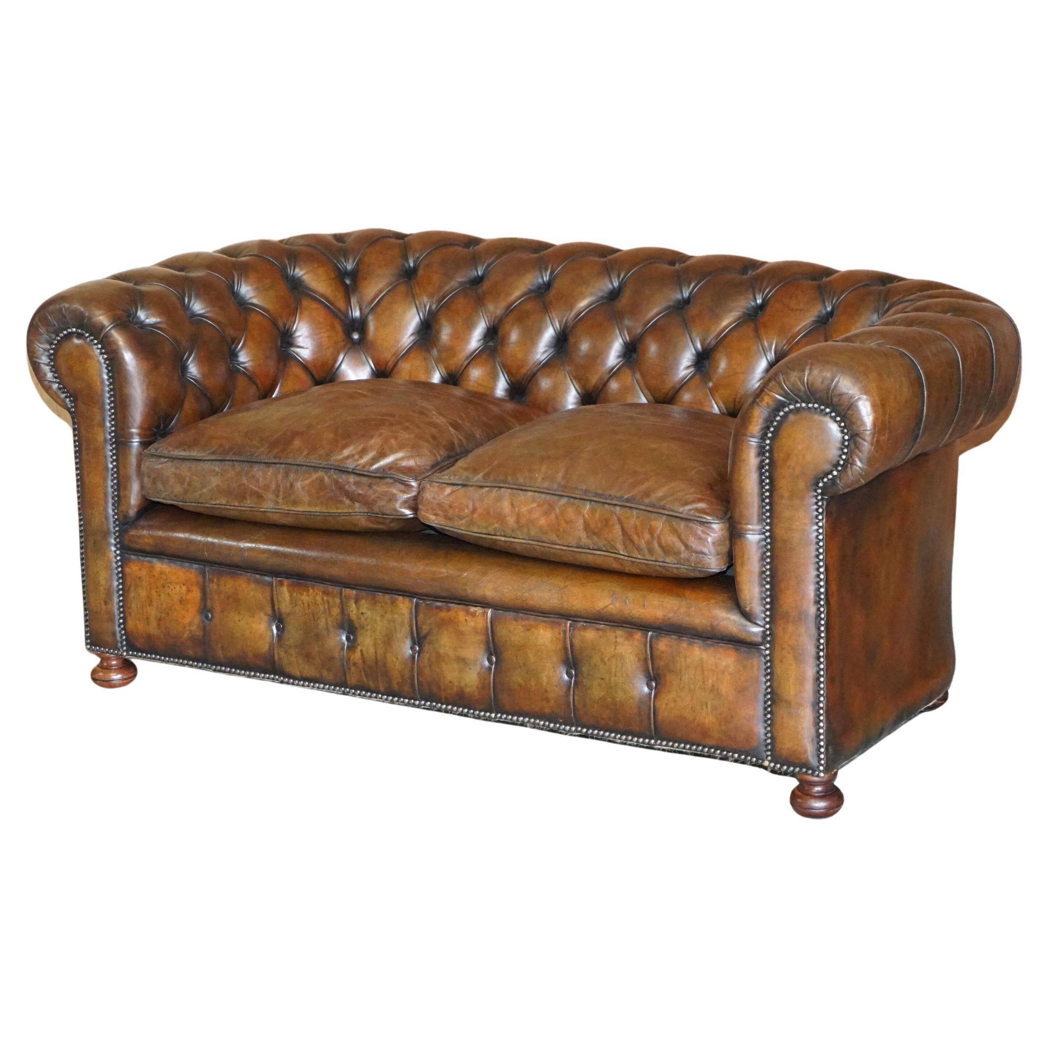 Restored leather Chesterfield sofa, walnut legs.