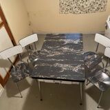 Table and 4 chairs in Formica.