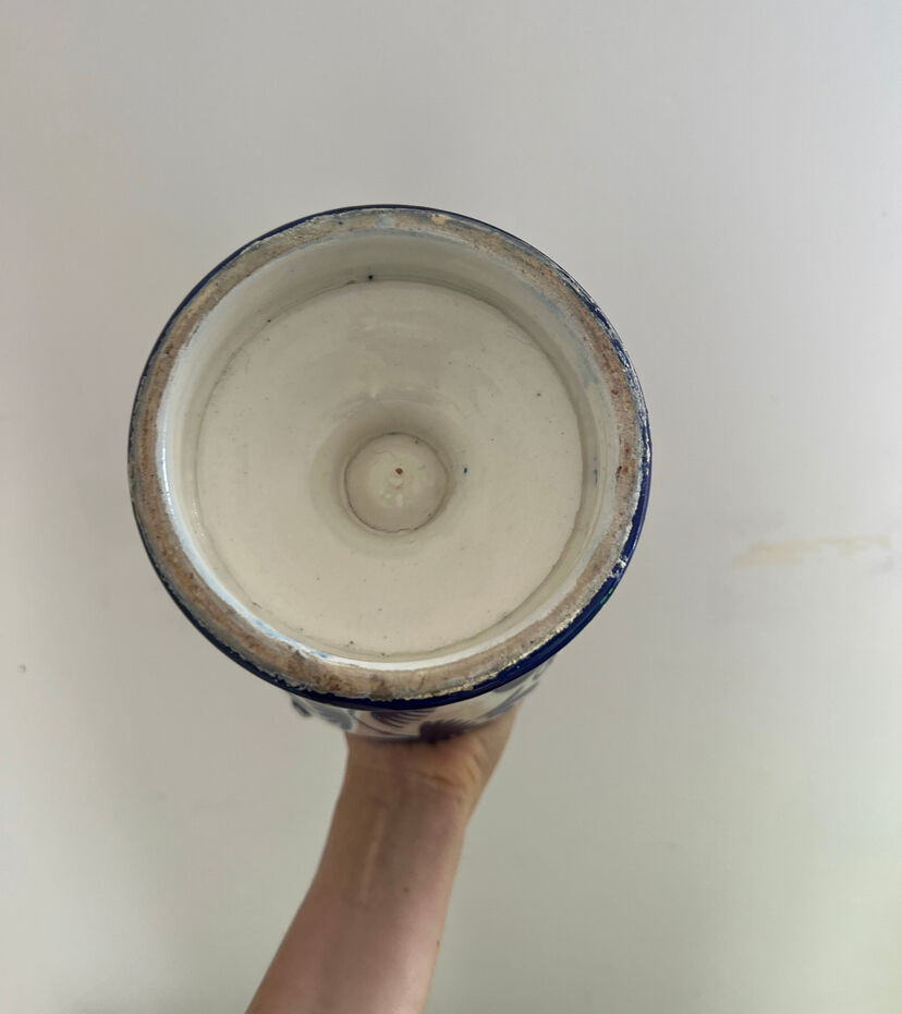 white amphora-style vase with hand-painted blue patterns