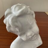 Cherub child bust in enamelled porcelain