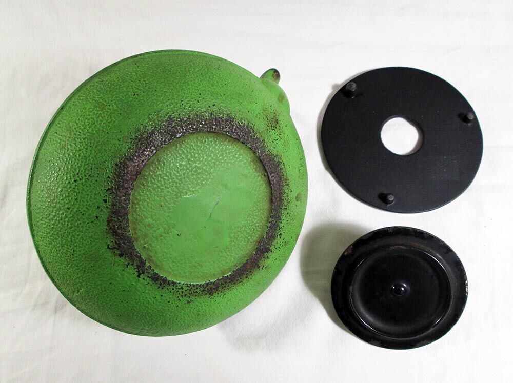 Flat cast iron teapot