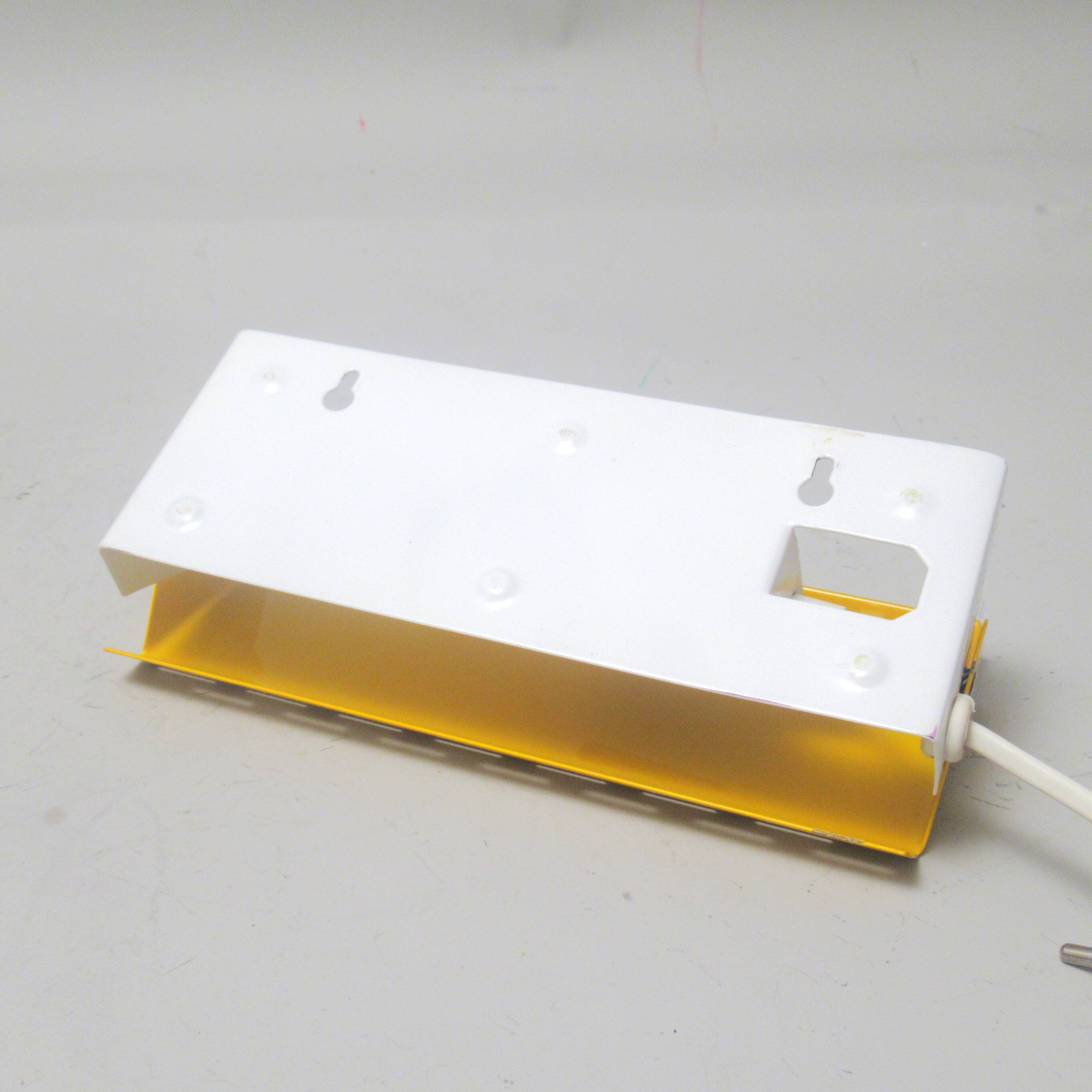 Modernist wall light with a yellow pivoting shade from the 1980s.