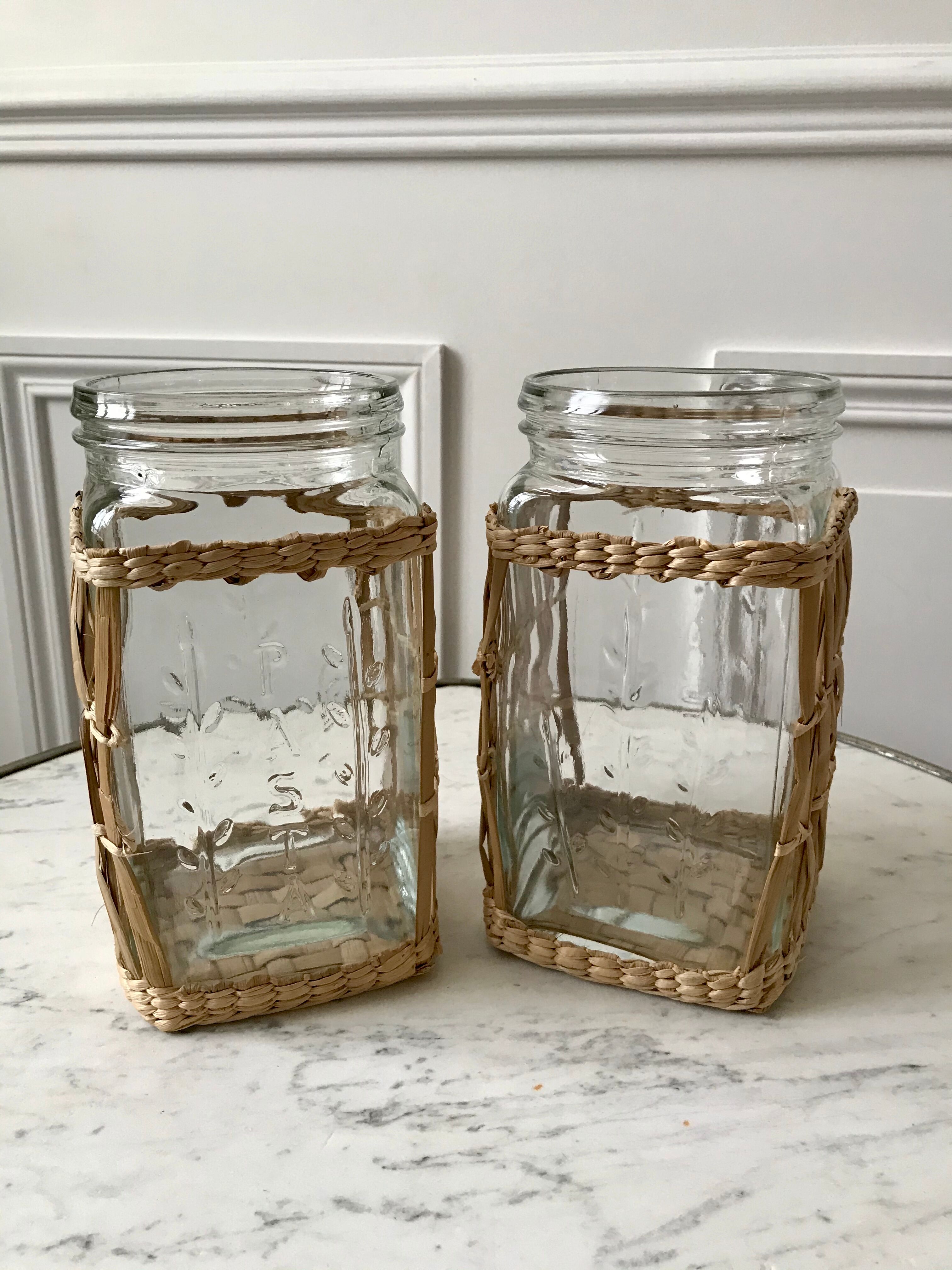 Duo of glass jars surrounded by vintage bamboo