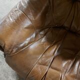 Armchairs in leather and vintage wood 70's