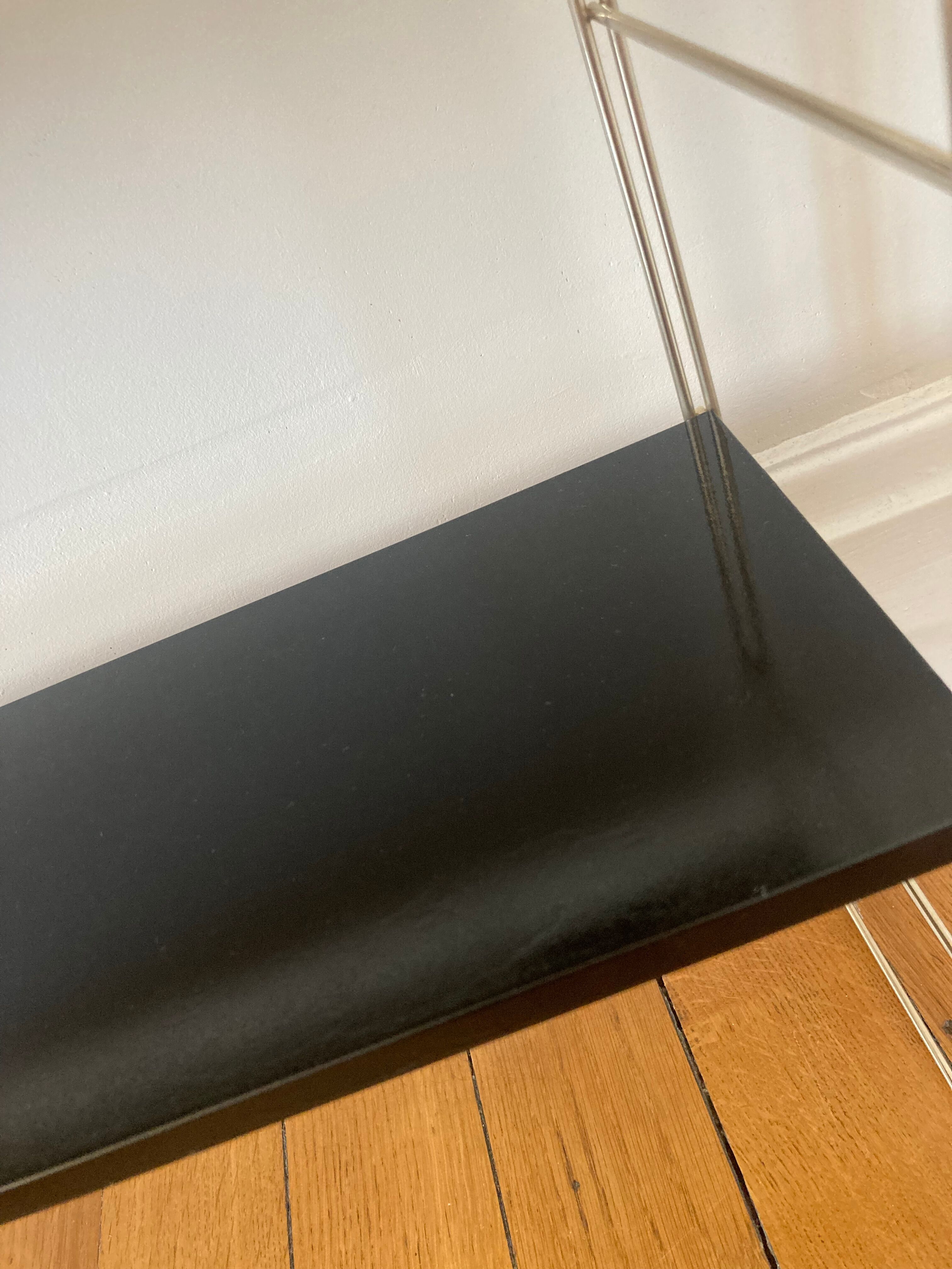 Black and gold string shelf