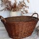 Large vintage dark wicker basket with handles