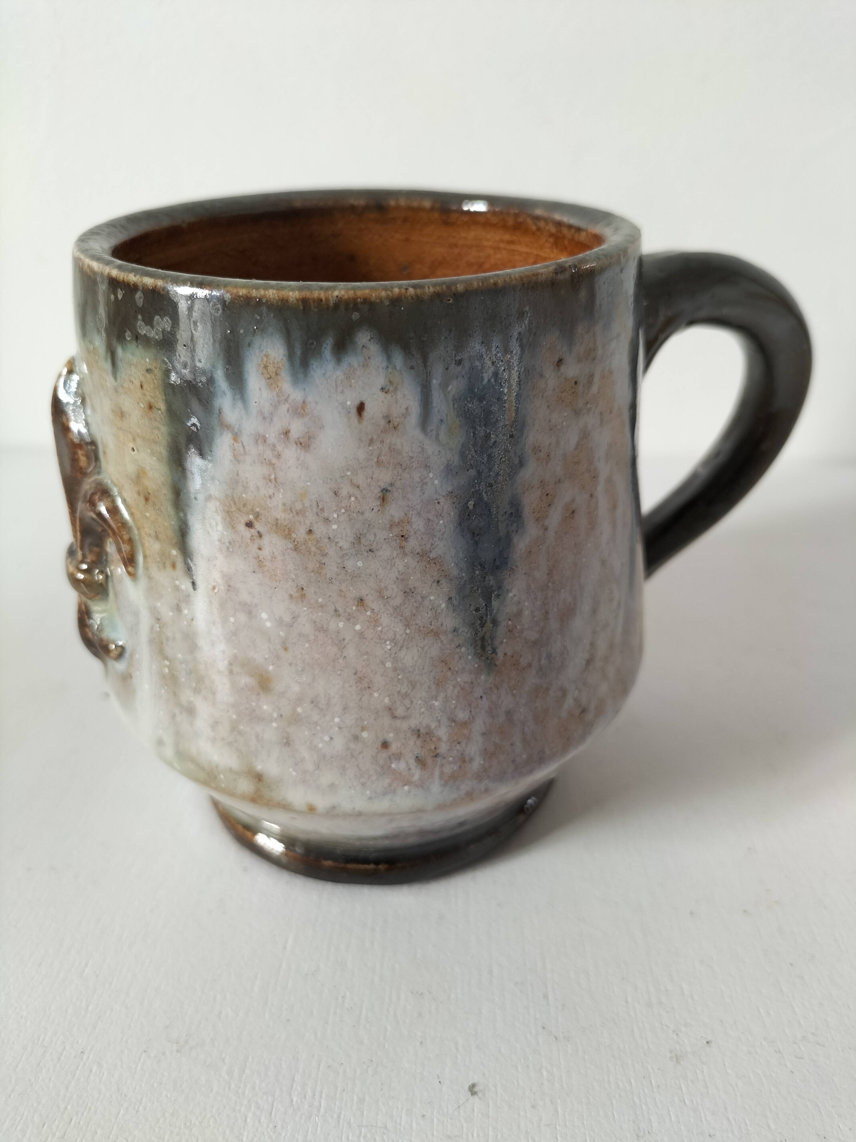 Fleur-de-lis glazed earthenware mug