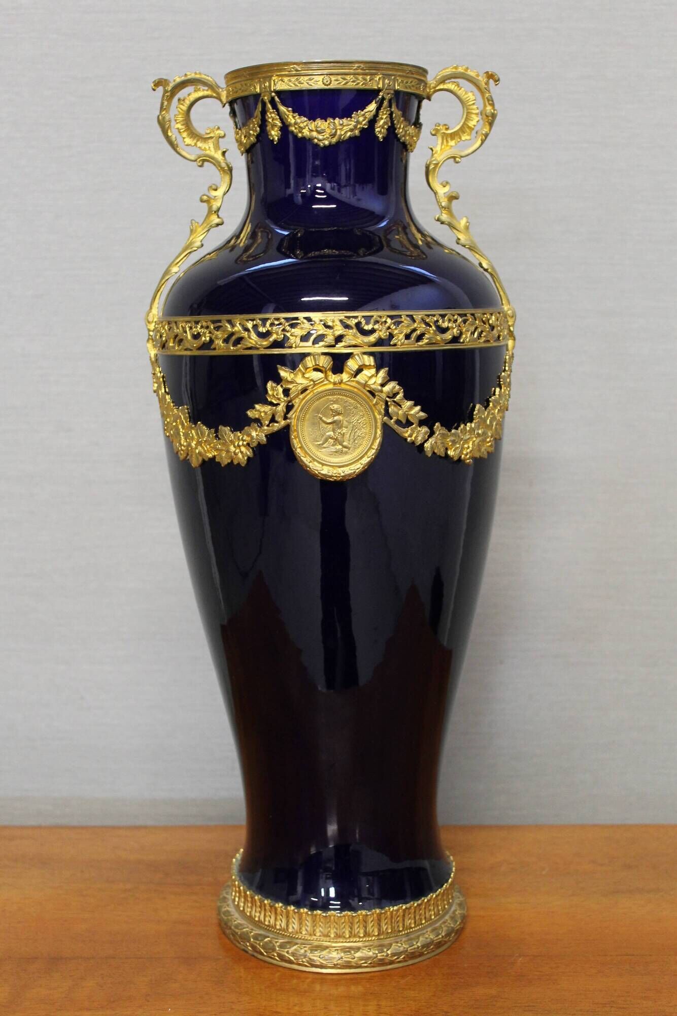 Vase signed Legastelois in blue ceramic of Sèvres and gilded bronze