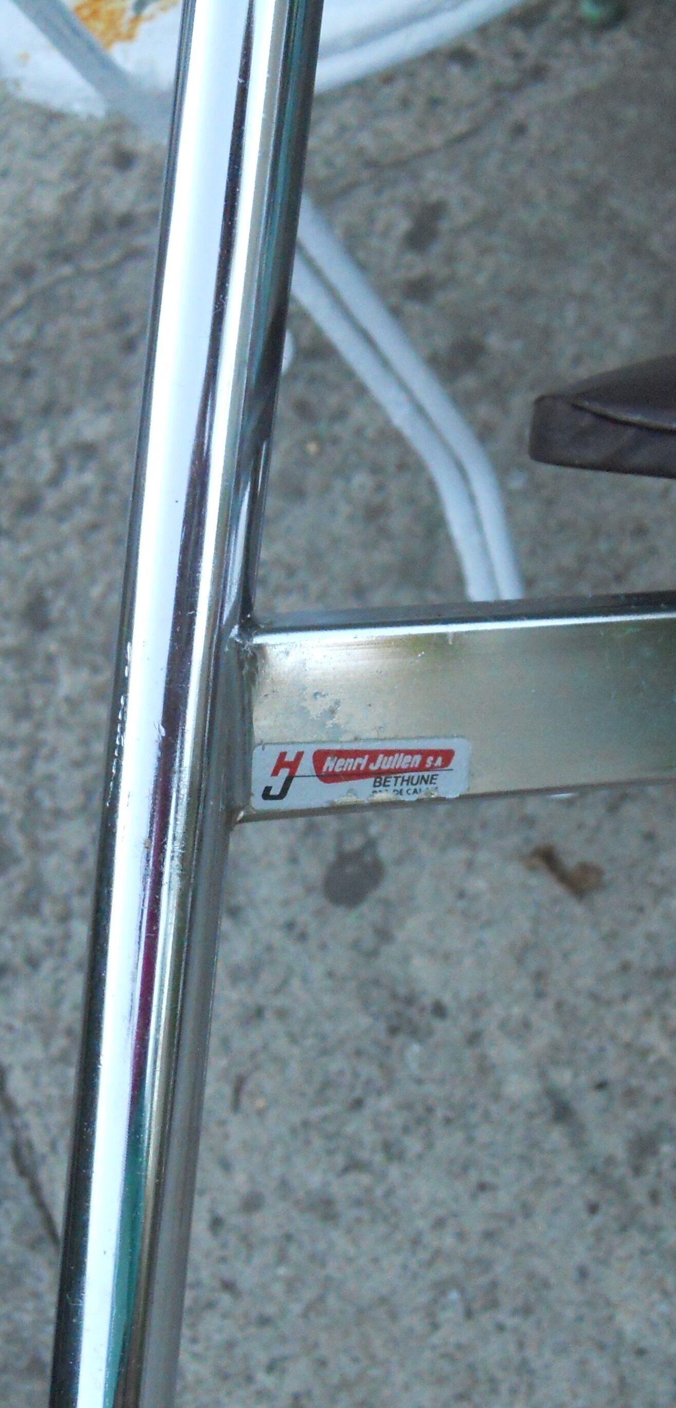 Vintage chrome metal chair and faux black leather