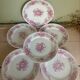 Set of 6 antique dessert plates in porcelain with pink flowers.
