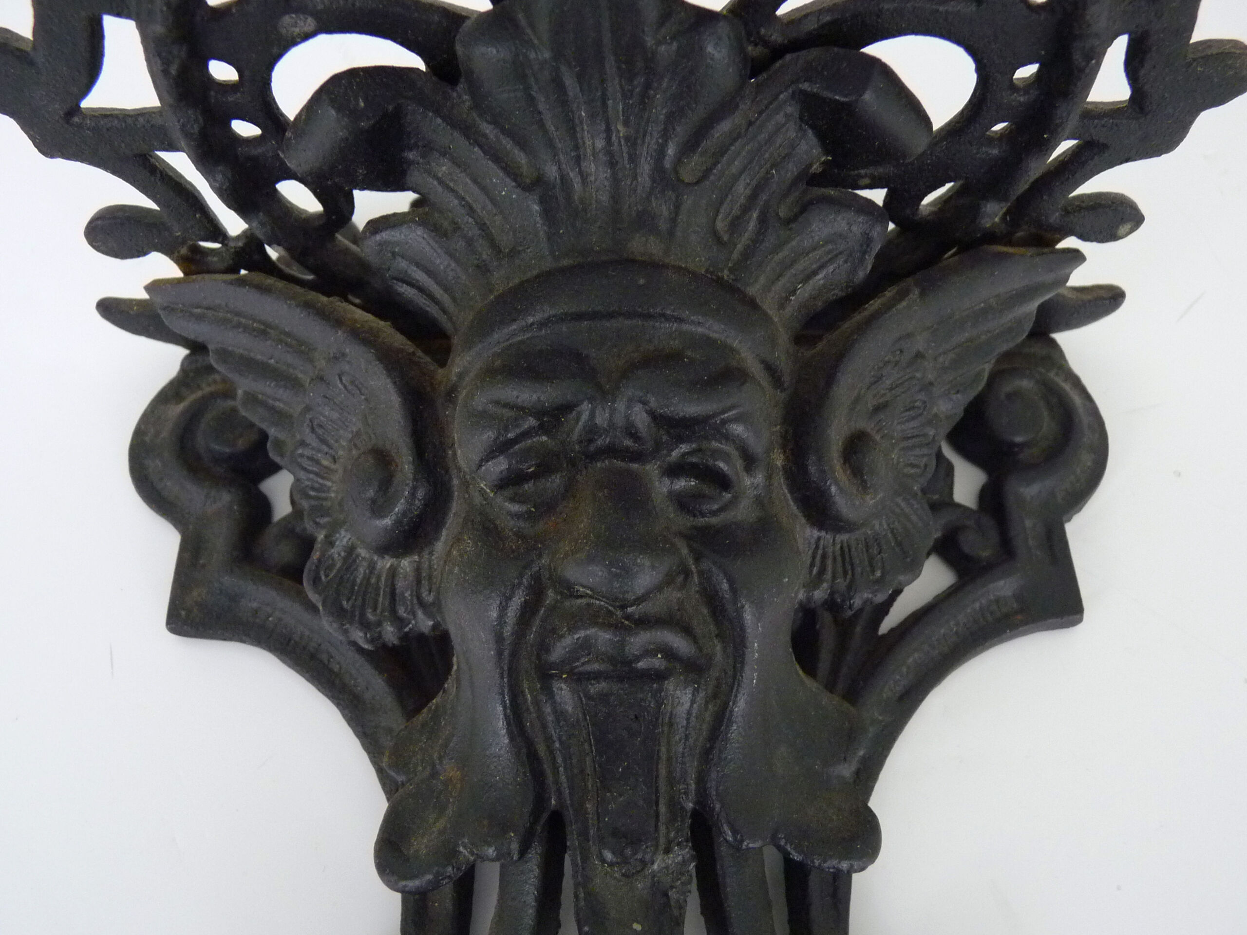 Harness, plant door, wall statue door with devil's head