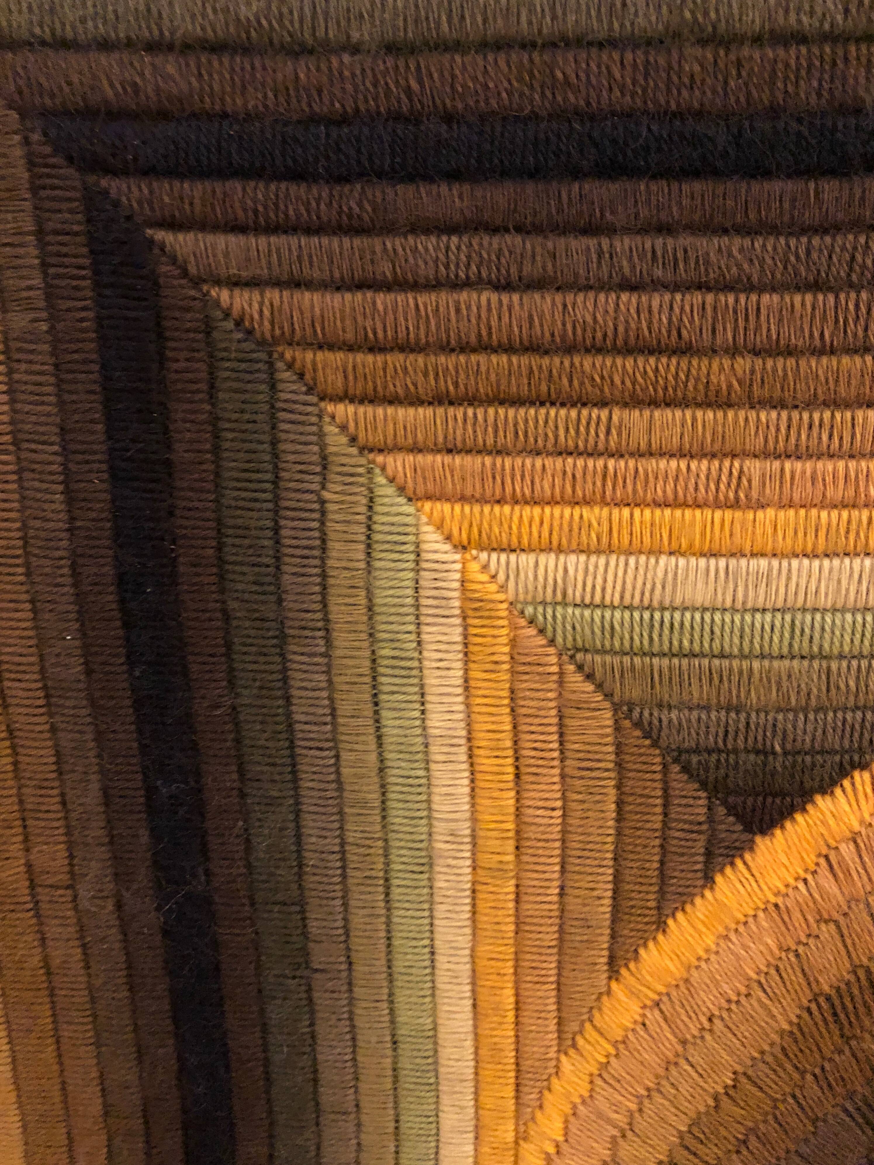 Kinetic tapestry with geometric pattern by Patrice Allard.