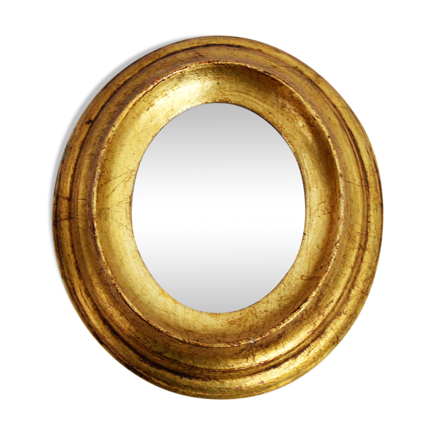 Golden oval mirror