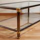 Hollywood regency gold metal & smoked silver coffee table, cut glass