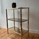 Brass and smoked glass library shelves