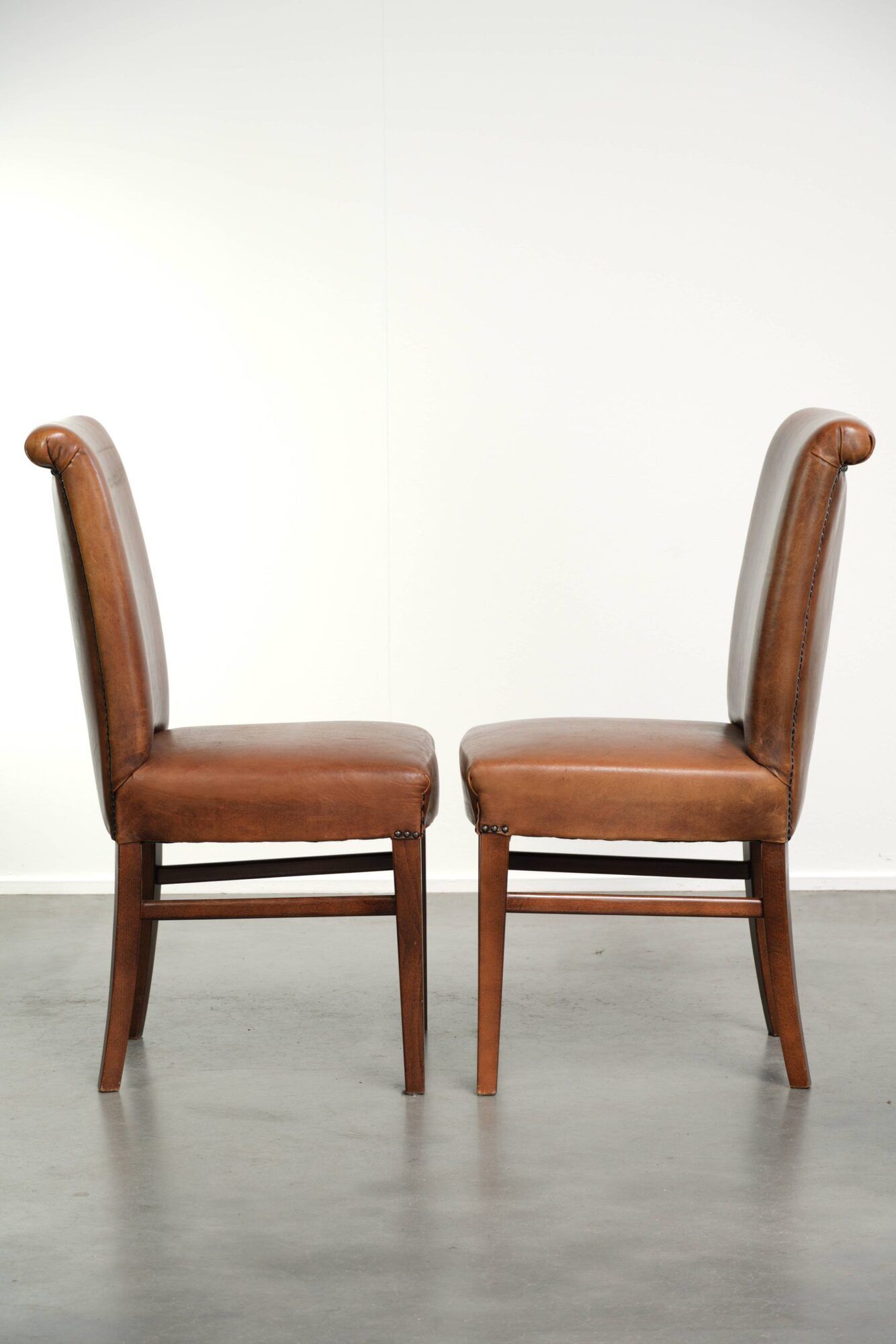 Set of 6 sheepskin dining chairs in a cognac colour with a lovely patina