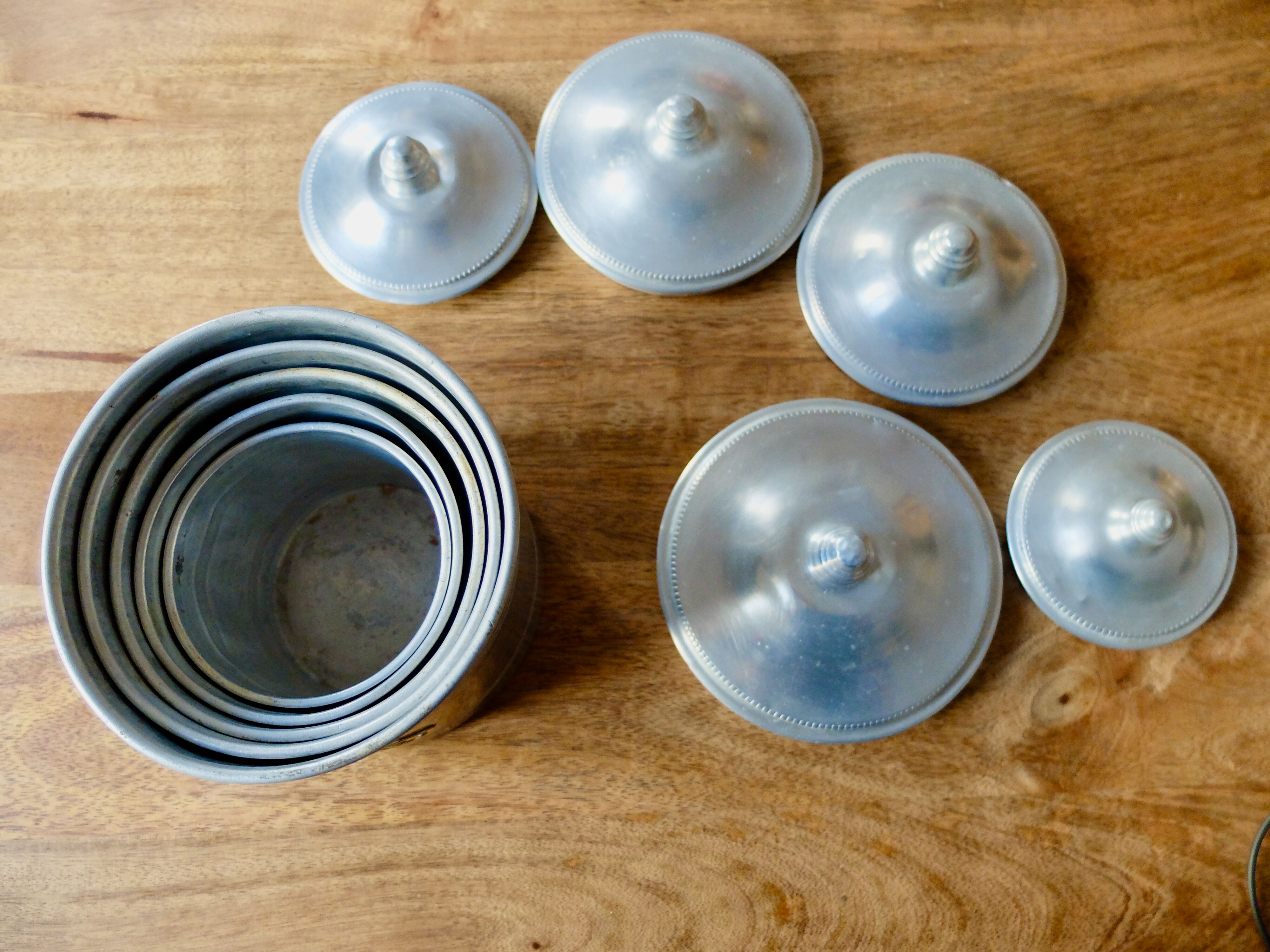 Series of 5 tin spice pots