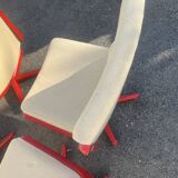 Set of 4 vintage 1970s swivel chairs in red and beige.