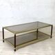 Vintage 1970s gold metal and smoked glass coffee table.