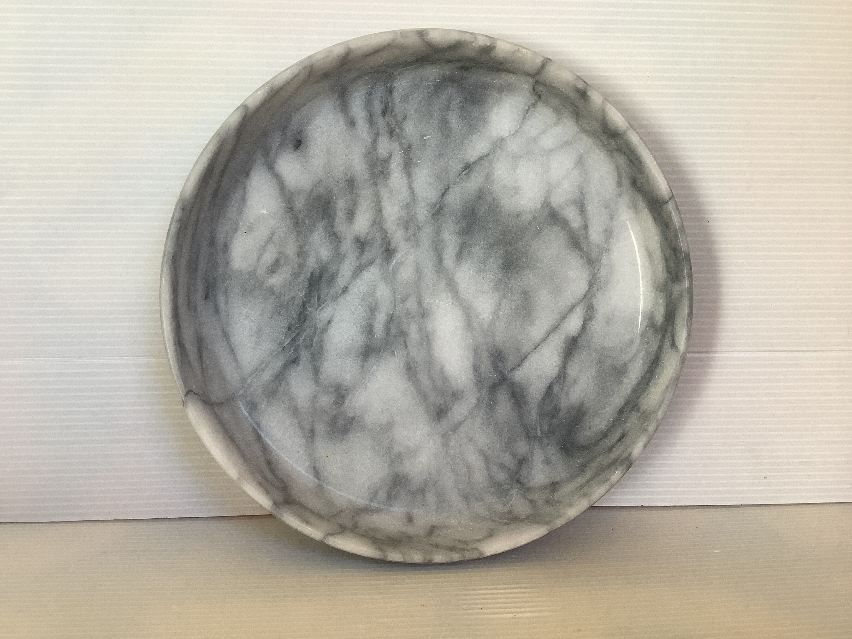 Empty round pocket in gray marble