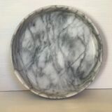 Empty round pocket in gray marble