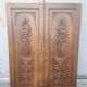 pair of antique solid oak cabinet doors with bird decor