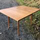 Vintage so-called portfolio table with oak compass base and its oak cp swivel top.