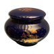 Porcelain candy box with golden floral decoration on a midnight blue background