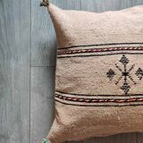 Beige Berber cushion with cotton pompom