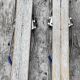 Pair of old children ski ings in blue wood